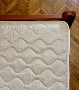 a mattress sitting on top of a wooden floor at Creative Apartment Kaleidoscope in Belgrade