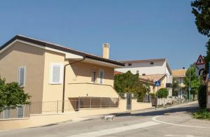 a dog walking in front of a house at B&B CIVICO CINQUE in Pianella