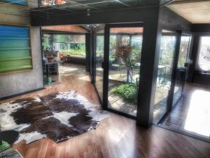 a room with glass doors and a rug on the floor at Casa mARTa : Suites, terrasses et vue panoramique in Tournon-sur-Rhône +51 photos
