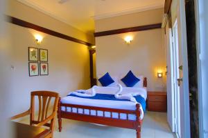 Voodi või voodid majutusasutuse Chithirapuram Palace toas
