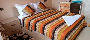 Una cama o camas en una habitación de Mirleft Tayought Guest House 37 fotos más