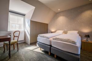 Gulta vai gultas numurā naktsmītnē Guesthouse Gillis7