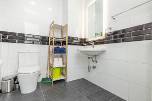 a bathroom with a toilet and a sink at kensington in St. Paul's Bay +15 photos