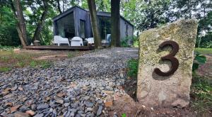 a house with a number on a rock at Domek Hrabiny nr 3 in Rozkochów +12 photos