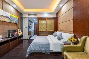 Μια τηλεόραση ή/και κέντρο ψυχαγωγίας στο 广州家馨商务住宿（科汇金谷神州路地铁站店）