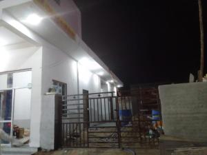a building under construction at night with a balcony at Tulsi bhavan in Khātu