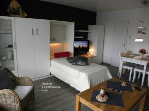 En eller flere senge i et værelse på Ferienwohnung Little Poseidon