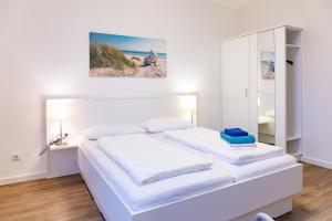 Postel nebo postele na pokoji v ubytování Haus Loccum