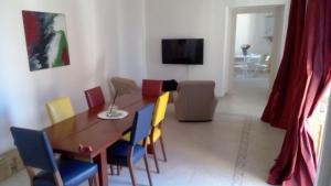 a dining room with a table and chairs at La CASA al CENTRO in LʼAquila +10 photos