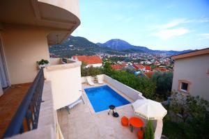 a swimming pool on the balcony of a house at Lemon Villa in Bar