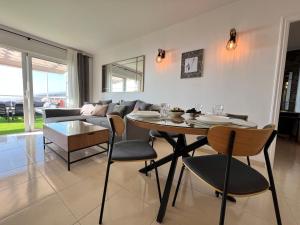 a living room with a table and a couch at Casa Prana in Adeje
