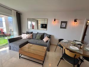 a living room with a couch and a table at Casa Prana in Adeje