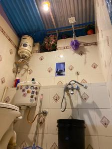 a bathroom with a shower and a toilet at Bob hostel in Jodhpur