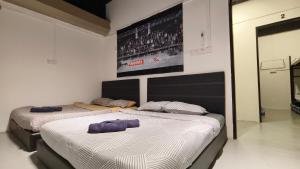 Letto o letti in una camera di Warisan Homestay 18pax Kota Kinabalu
