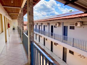an empty corridor of a building with a balcony at Hotel Bambú in Tailandia