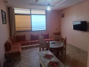TV a/nebo společenská místnost v ubytování Residence perle de l'ocean