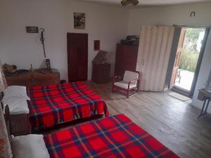 Ένα ή περισσότερα κρεβάτια σε δωμάτιο στο Posada Turistica Altamisal