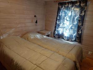 Postel nebo postele na pokoji v ubytování Hillatupa