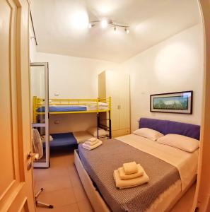 Postel nebo postele na pokoji v ubytování Bilocale Casa Manu Garden