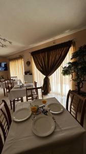 a dining room with a table and chairs and a table and chairsktop at Το Πέτρινο in Kiriákion +58 photos