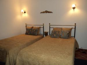Кровать или кровати в номере Alojamento Pero Rodrigues