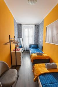 Postel nebo postele na pokoji v ubytování Camilla & Friends House