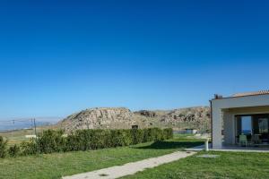 a house with a view of a mountain at B&B L'EDEN DI CAPO BIANCO in Montallegro