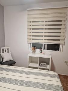 Postel nebo postele na pokoji v ubytování Habitaciones Zoe