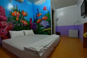 Postel nebo postele na pokoji v ubytování Haichian Hostel
