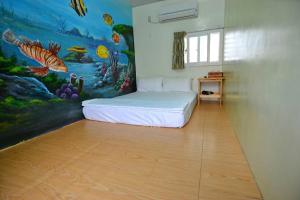Postel nebo postele na pokoji v ubytování Haichian Hostel