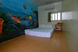 Postel nebo postele na pokoji v ubytování Haichian Hostel