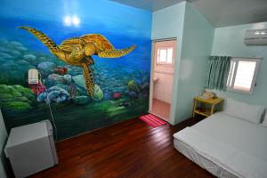 Postel nebo postele na pokoji v ubytování Haichian Hostel