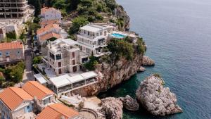 an aerial view of a house on a cliff at Blanche Cliff Apartments in Sveti Stefan