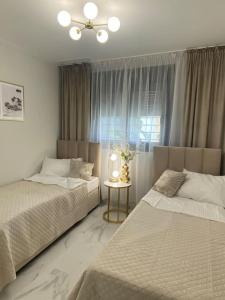 Postel nebo postele na pokoji v ubytování Flamenca Village