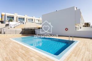 a view of the swimming pool in a villa at The Oasis El Medano, by Nivariahost in El Médano