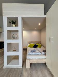 a small room with a bed in the middle at Ava Central Residence in Budapest