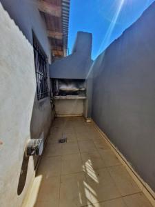 an empty hallway with a skateboard on the side of a building at Güemes 4 in General Roca