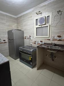 Kuchyň nebo kuchyňský kout v ubytování Apartment in jannet zayed 2