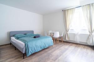 Postel nebo postele na pokoji v ubytování Stodolička