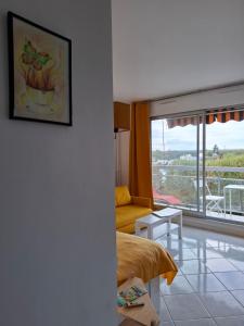 Posezení v ubytování Le Belvédère - Studio Lumineux - Vue & Terrasse