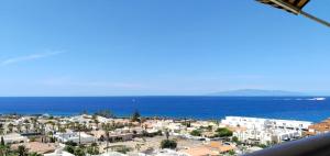 a view of a city and the ocean at Palm-Mar Penthouse Celeste vue mer panoramique 200m de l'océan in Palm-Mar