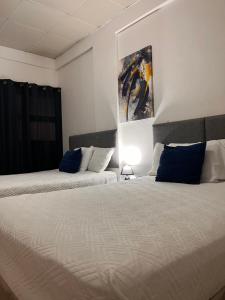 Postel nebo postele na pokoji v ubytování Apartamentos Trebol