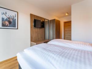 Postel nebo postele na pokoji v ubytování Grebenzen Lodge 1028