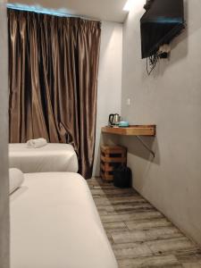 G9 Hotel Alor Setar客房内的一张或多张床位