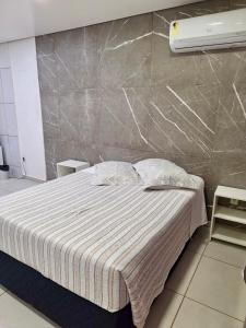 Postel nebo postele na pokoji v ubytování Kitnet 1 mobiliada no centro de Torres a 600m da Praia Grande