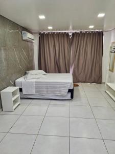 Koupelna v ubytování Kitnet 1 mobiliada no centro de Torres a 600m da Praia Grande