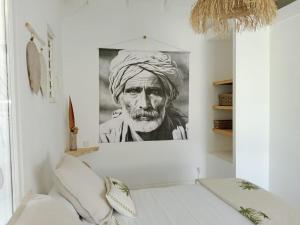 a painting of a man with a beard on a wall at Villa Lola- Au cœur de la BO - 100m de la plage, cuve 800L in Orient Bay