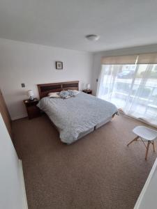 Кровать или кровати в номере Hermoso Departamento de Descanso y Relajo En Condominio Quebrada La Candelaria Algarrobo