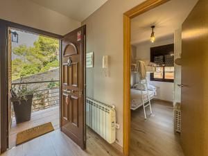a hallway with a door leading to a balcony at Villa Mar & Natura Sitges in Canyelles +56 photos