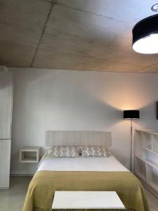 Ένα ή περισσότερα κρεβάτια σε δωμάτιο στο Studio La Abadía